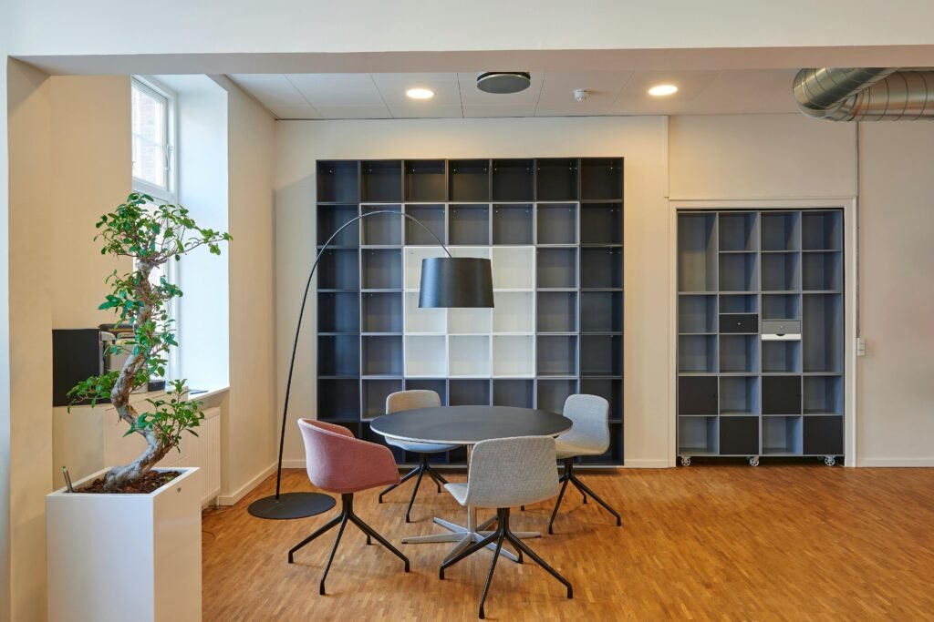 pexels-photo-245240-245240 Bright and stylish office space with contemporary furniture and open shelving.